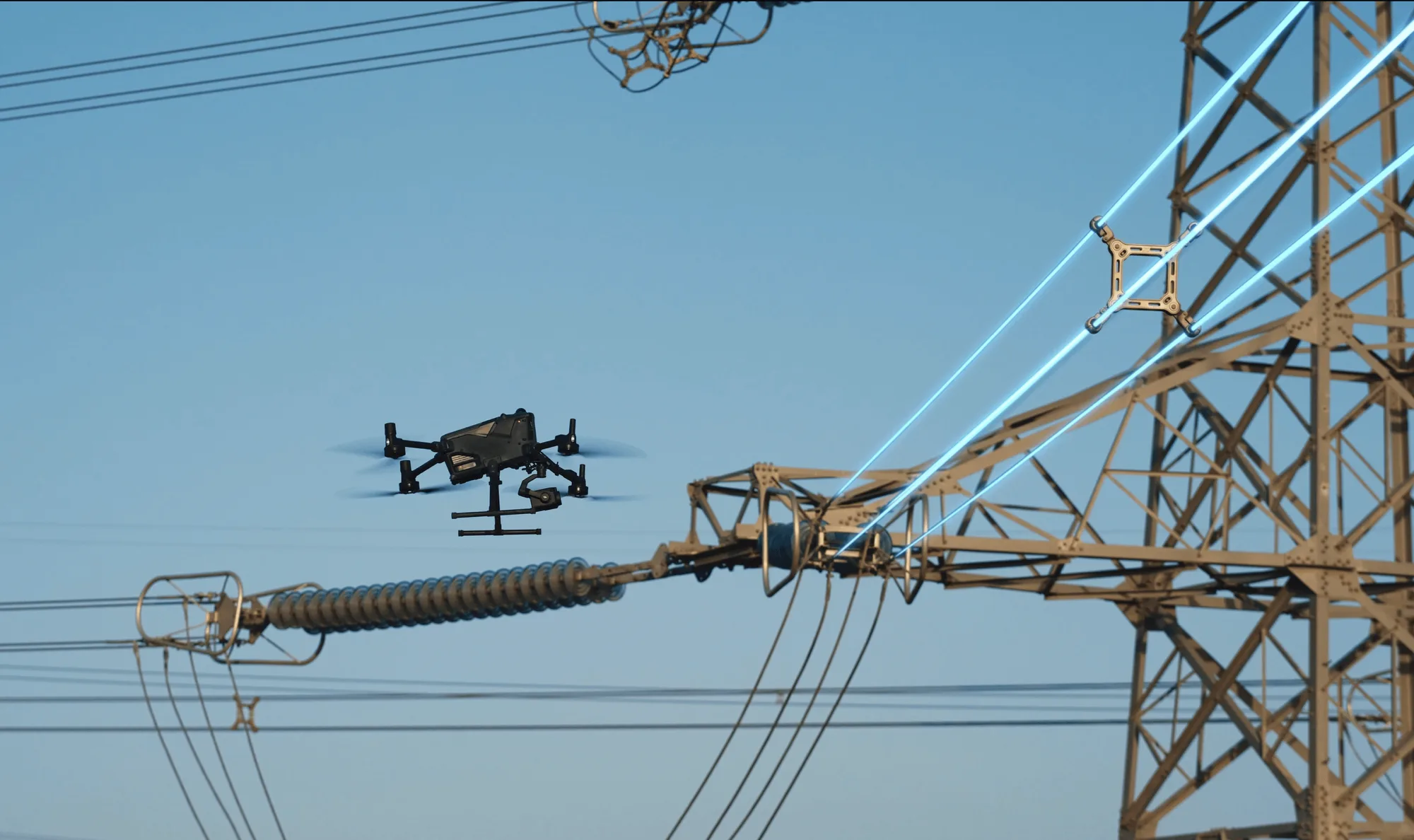 DJI Matrice 400 inspecting a high-voltage transmission tower