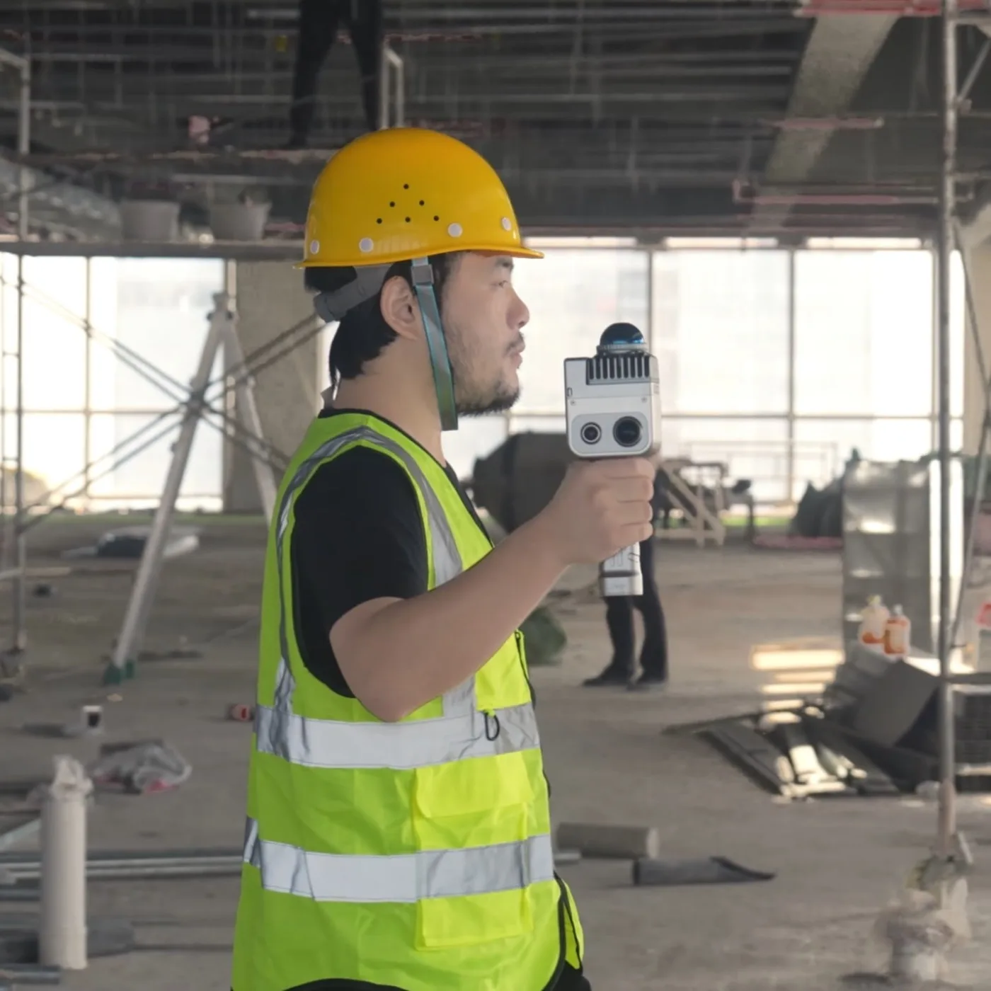 Construction worker scanning a building interior with a LixelKity K1