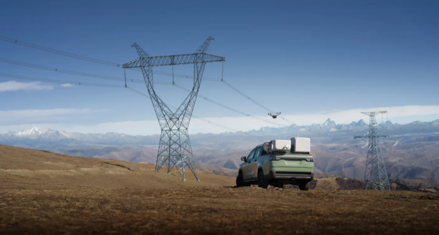 DJI Dock 3 vehicle-mounted in a pickup truck bed near power lines