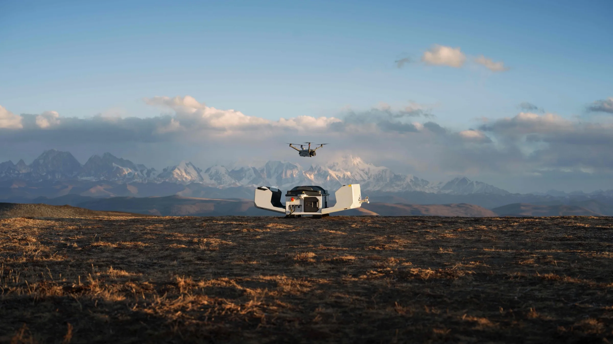 DJI Dock 3 deployed on a mountain ridge with a drone launching